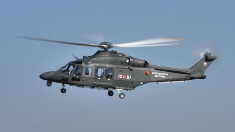 Thiene Italy, OCTOBER, 16, 2021 Isolated military helicopter in flight in the blue sky. Agusta Westland AW139 Leonardo HH139 of Italian Air Force