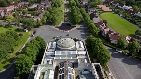 PORT SUNLIGHT, MERSEYSIDE, UK - JUNE 06, 2020: Drone orbit above The Lady Lever Art Gallery with fountain in background, Port Sunlight
