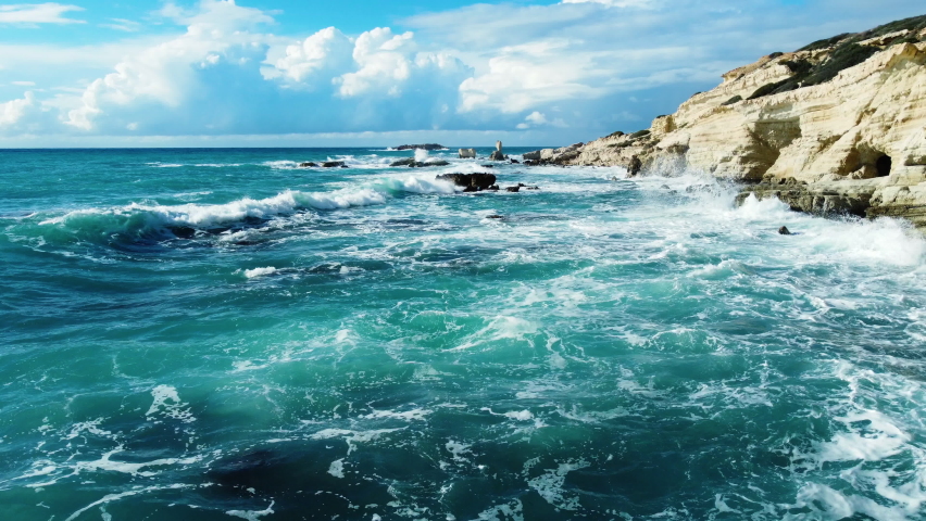 Sea waves on the coast, Rocky seashore in stormy weather, Aerial view over the ocean, Nature Cyprus