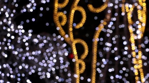 Blurred background, out of focus, blur. Night city lights. Beautiful street decoration