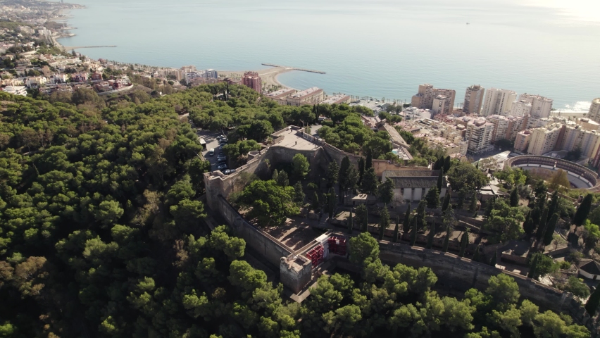 Medieval Gibralfaro Castle ruins, sweeping city views from hilltop; aerial
