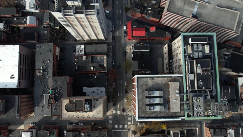 Top Down Aerial View, Car Moving on Street Between Modern Buildings in American City, Downtown Harrisburg, Pennsylvania USA, High Angle Drone Shot