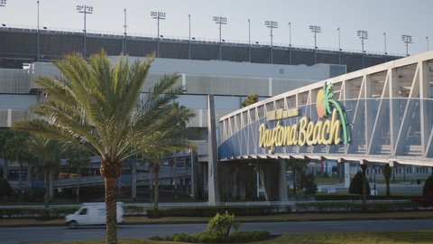 Daytona Beach, Florida - February 1, 2022: Daytona Beach sign with palm tree near the Daytona International Speedway NASCAR race track