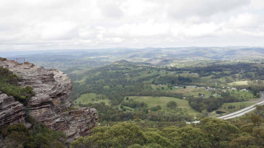 Drone aerial footage of a large valley and the nearby landscape near the town of Lithgow in the Central Tablelands area of New South Wales in Australia