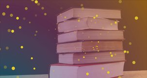 Animation of yellow spots over books on black background. world book night and celebration concept digitally generated video.