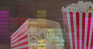 Animation of retro text over boxes of popcorn. popcorn day and celebration concept digitally generated video.