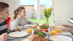4K 60 fps video of  children having healthy breakfast at home in the morning 