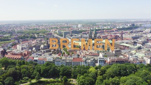 Inscription on video. Bremen, Germany. The historic part of Bremen, the old town. Bremen Cathedral ( St. Petri Dom Bremen ). View in flight. Appears from the sand, Aerial View, Point of interest