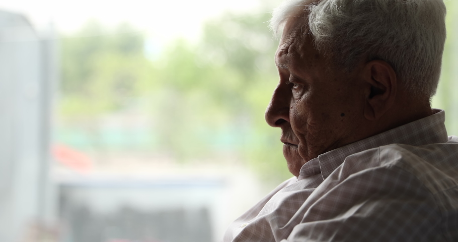 Close up face of older man sits on couch lost in sad thoughts, 80s grandfather suffers from loneliness at nursing home. Chronic senile diseases, dementia, life regrets, nostalgia, melancholy concept | Shutterstock HD Video #1087300049