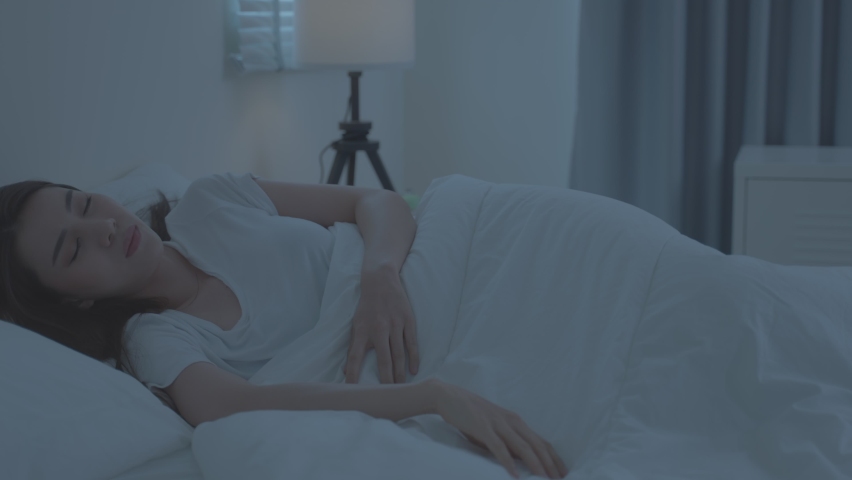 Asian young woman scratch hand feel suffer from allergy while sleeping. Beautiful attractive girl lying on bed in bedroom suffering from itching arm skin allergic reaction to insect bites, dermatitis. Royalty-Free Stock Footage #1087305581