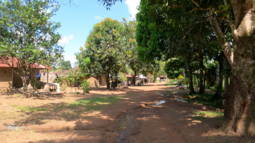 KENEMA, SIERRA LEONE - 16 OCT 2021: Kenema Sierra Leone rural jungle village Africa POV. Third largest city in the country. West Africa suffers with extreme poverty. Tropical climate.