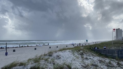 Panama City Beach, Florida, United States - October 11, 2018. Outer bands of category 5 hurricane Michael arriving at Panama City Beach. Heavy wind and storm surge at the beach with red flag warning.