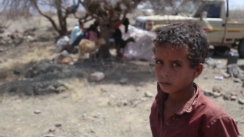 sad yemeni kid displaced on first day of displacement from his home because of the war ,Taiz Governorate, Yemen  4 January 2021