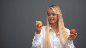 A girl poses with apples in the studio