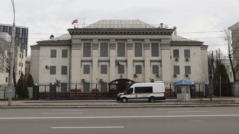 Kyiv, Ukraine - 20 feb 2022: Russian embassy in Kiev. Fence with barbed wire, windows closed with metal shields. The building is guarded by the police of Ukraine. Day, winter, cloudy.