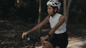 cyclist girl training. Cyclist Woman in Helmet on Bike