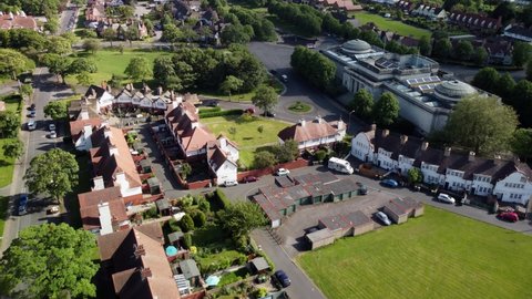 Drone shot over houses in Port Sunlight with The Lady Lever Art Gallery and fountain