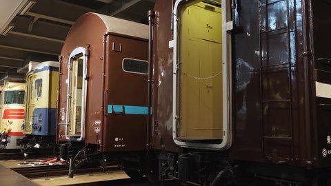 Nagoya.Japan-October 31.2019: Old train wagons displayed in the railway museum in Nagoya Japan. Different designs. Vintage. Camera slowly turning left.