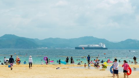 Iojima island, Japan. View of Costa del Sol beach resort during the sunny day with mountains at the background. Iojima island located near Nagasaki, Kyushu, Japan. Time-lapse, panning video