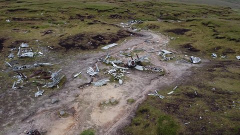 Aerial shot panning around the Bleaklow Bomber plane wreckage near the higher shelf stones in the Peak District.