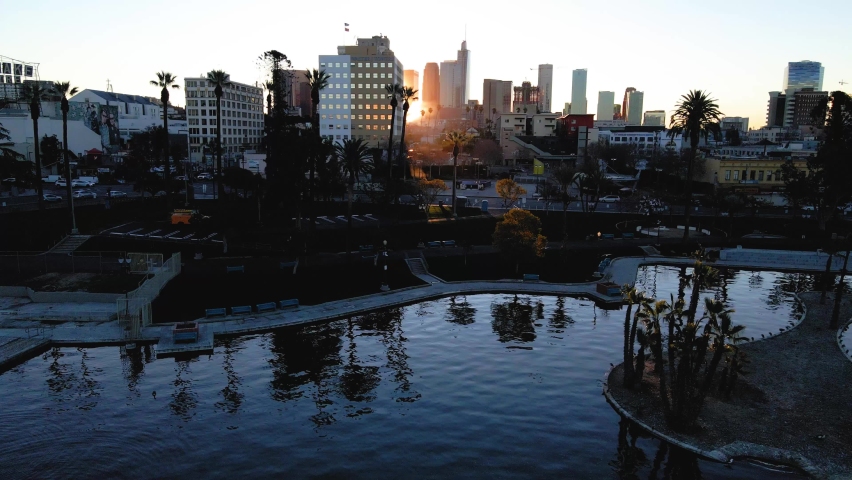 Aerial Pull Away Shot of Sunrise at MacArthur Park, Los Angeles, DTLA Skyline