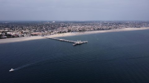 An amazing aerial drone shot, drone flying towards Belmont Veterans Memorial Pier in Long Beach, California.