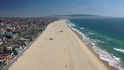 Long Stretch Of Sandy Beach - Manhattan Beach In California - aerial drone shot