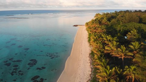 Aerail footage of white sand beach in the Rarotonga in the Cooks island in the southern Pacific. Shot with a forward motion