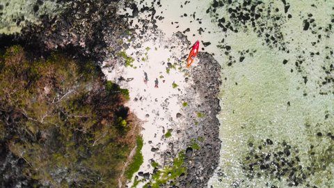 Top down aerial a small uninhabited island Taakoka in Muri lagoon in Rarotonga, Cook islands
