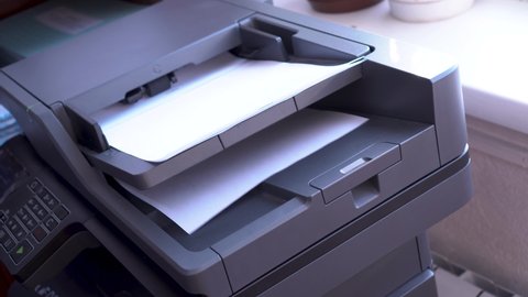 multifunctional device that combines the functions of a printer, scanner, fax device, copy module. scanning images from sheets of paper.