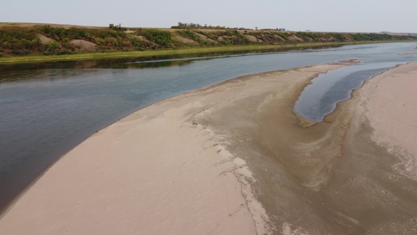 Drone Footage of the South Saskatchewan river. Flying over a beautiful peninsula caused by low tide in the summer.