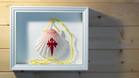 decorative wooden frame with pilgrim shell scallop from the Camino de Santiago to Compostela Galicia Spain , hd video footage