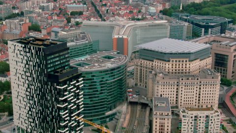 Establishing Aerial View of Brussels Downtown with Political Landmark - headquarters of the EU Commission Berlaymont in European Quarter. Office buildings in Bruxelles, Belgium. 4K drone zoom in shot