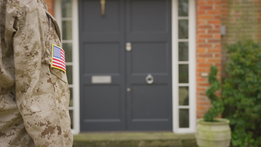 Military family open front door and run to greet mother returning home on leave - shot in slow motion Royalty-Free Stock Footage #1087415096