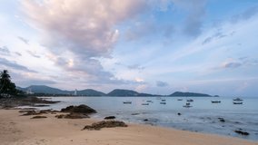 Beautiful blue sky white clouds over sea in the morning with Thai Longtail fisherman boats at Patong beach Phuket Thailand Time lapse video for Travel and tour background