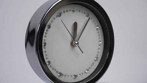 Closeup Crystal bling wall clock ticking and rotated