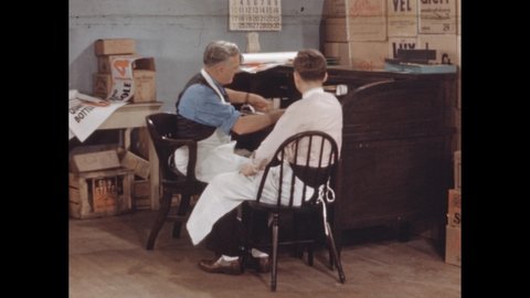 1940s: Workers sitting at desk in stockroom. Students in classroom taking notes.