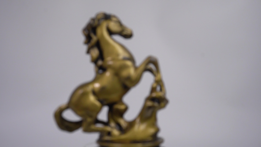 Golden Horse statue rotated,out of focus,can use for background video