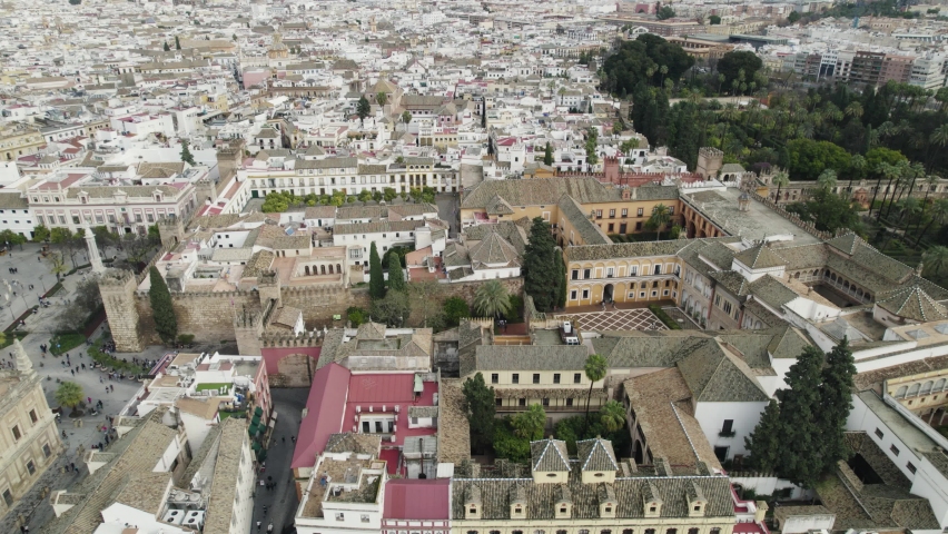 Circular aerial view of "Archivo General de Indias" surrounded by the city. Seville. Spain