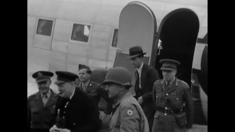 CIRCA 1944 - Prime Minister Churchill arrives in Normandy by plane, where he is met by Generals Lee and Sir Hastings Ismay.