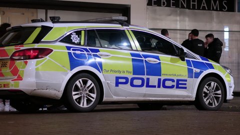 Norwich, Norfolk, United Kingdom. February 19, 2022. Norfolk Constabulary Vauxhall police car parked on a street at night in Norwich.