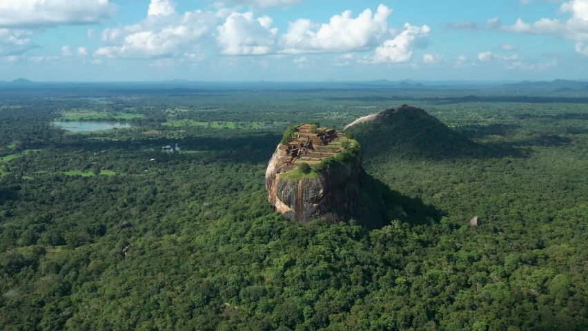 Aerial view of Sigiriya Rock Fortress called Lion Rock during sunny daytime, Sri Lanka Royalty-Free Stock Footage #1087454975