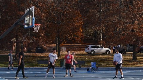 ROCHESTER , NY , United States - 10 01 2020: Rochester, NY, 01 October 2020 – Young men warm up their basketball skills 