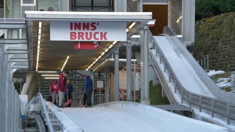Innsbruck , Austria - 11 11 2021: Workers Scraping Bobsleigh Track To Smoothen the Ice.