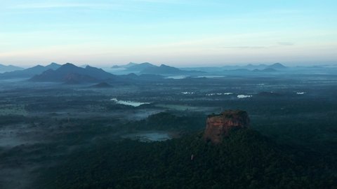 Aerial view of the famous Sigiriya Rock Fortress called Lion Rock in blue hour before sunrise, Sri Lanka
