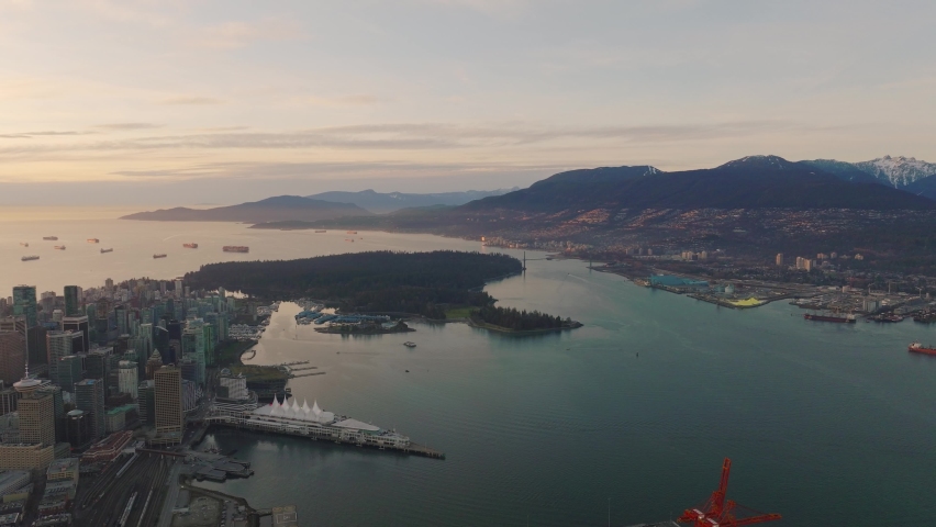 Aerial Drone shoot of Downtown Vancouver and Stanely Park during Sunset in 4K Royalty-Free Stock Footage #1087455545