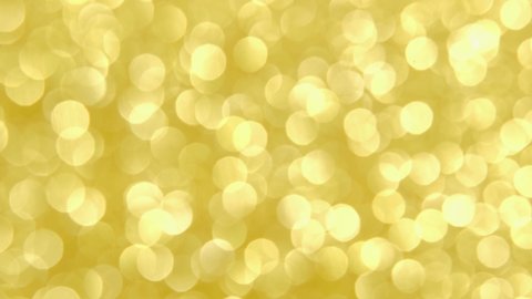 Defocused blurred background. The bokeh lights up in yellow gold. 4k holiday or spring background. Easter background