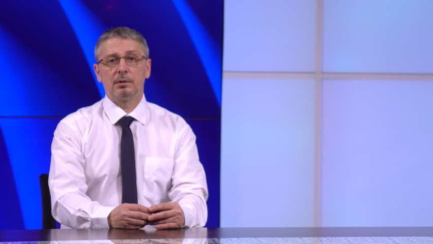 News anchor in the studio, live. He