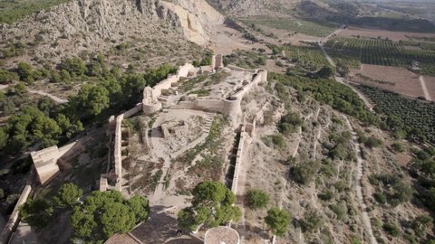 Drone footage of the white Hermitage of La Magdalena and old castle ruins on top of the hill in Castellon