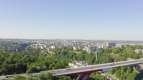 Inscription on video. Luxembourg, Historical city center in the morning. Pont Rouge. Shimmers in colors purple, Aerial View